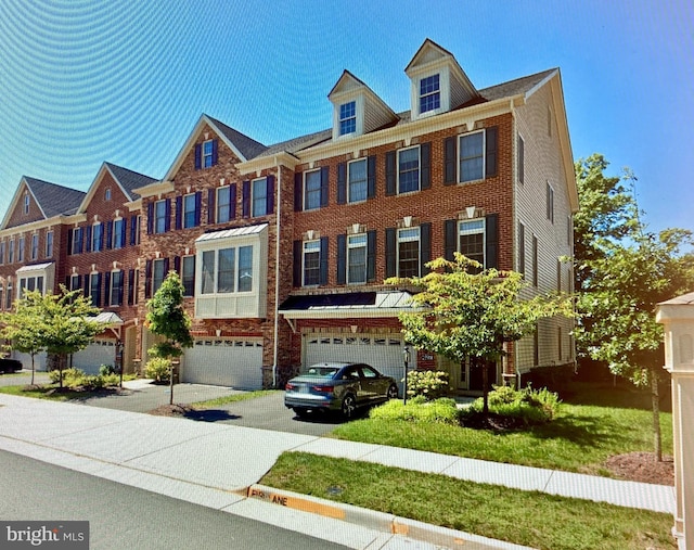 22559 Windsor Locks Sq, Ashburn, VA 20148 - view of front of property with driveway, an attached garage, and brick siding
