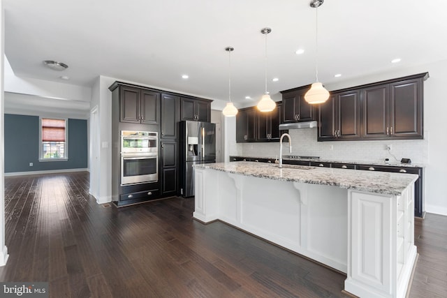 22559 Windsor Locks Sq, Ashburn, VA 20148 - kitchen with appliances with stainless steel finishes, decorative backsplash, a sink, dark wood finished floors, and recessed lighting