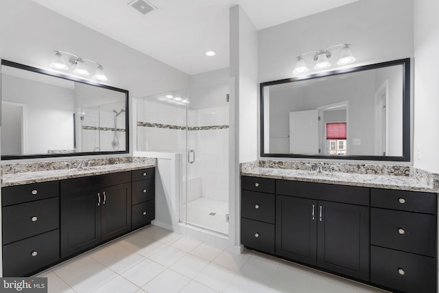 22559 Windsor Locks Sq, Ashburn, VA 20148 - full bathroom with a stall shower, two vanities, and tile patterned floors
