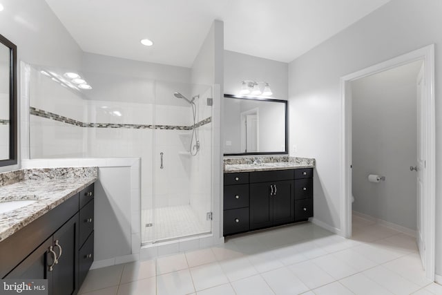 22559 Windsor Locks Sq, Ashburn, VA 20148 - full bath featuring a shower stall, two vanities, tile patterned floors, baseboards, and toilet