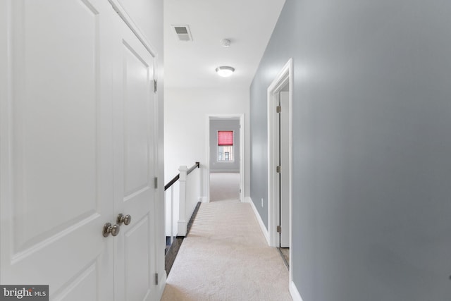 22559 Windsor Locks Sq, Ashburn, VA 20148 - hallway featuring carpet flooring, baseboards, and an upstairs landing