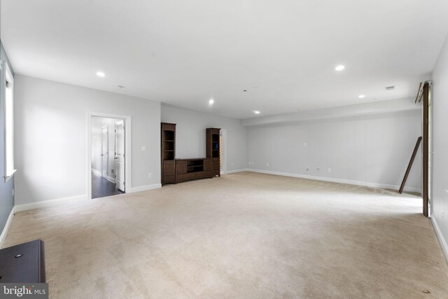 22559 Windsor Locks Sq, Ashburn, VA 20148 - unfurnished living room with recessed lighting, carpet flooring, and baseboards