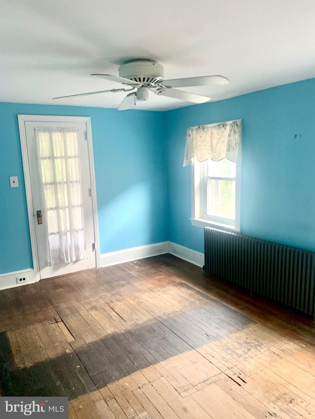 42 E 5th St, New Castle, DE 19720 - unfurnished room with radiator, hardwood / wood-style flooring, and a ceiling fan