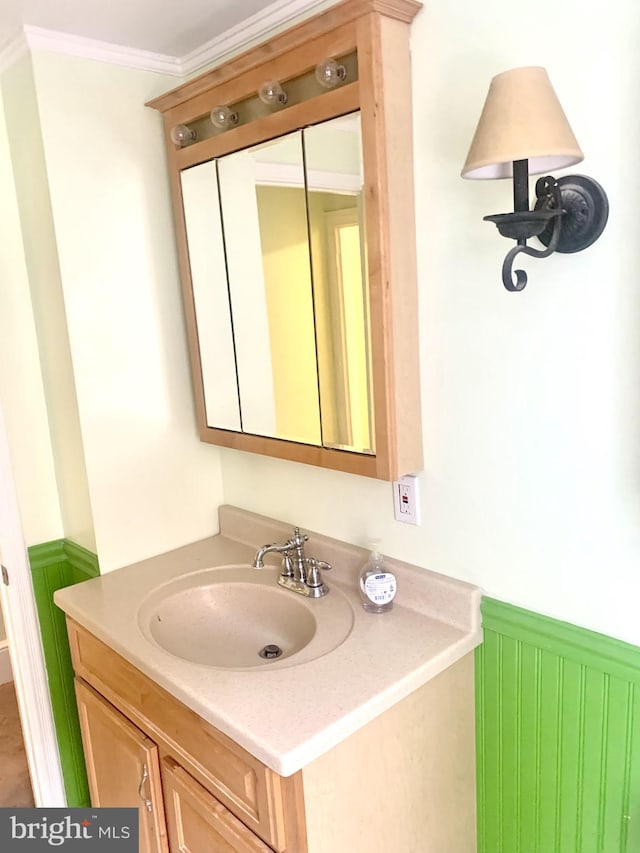 42 E 5th St, New Castle, DE 19720 - bathroom featuring vanity, wainscoting, and crown molding