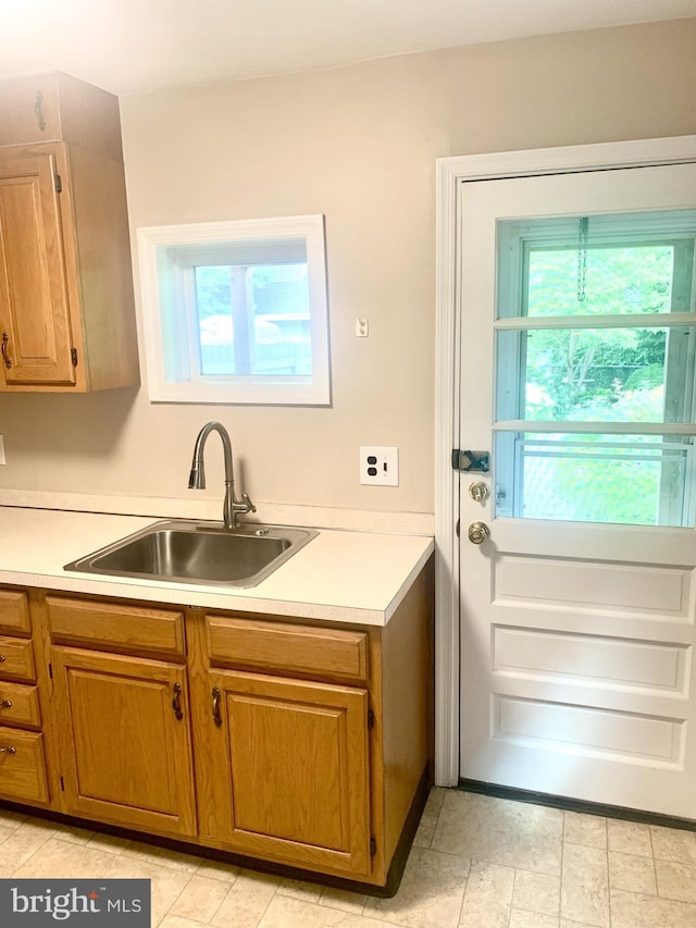42 E 5th St, New Castle, DE 19720 - kitchen with light countertops and brown cabinetry