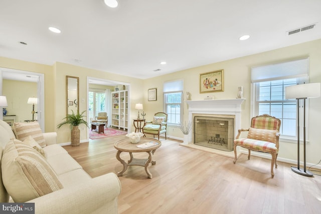 5810 Linden Square Ct, North Bethesda, MD 20852 - living area with wood finished floors, baseboards, a fireplace, and recessed lighting