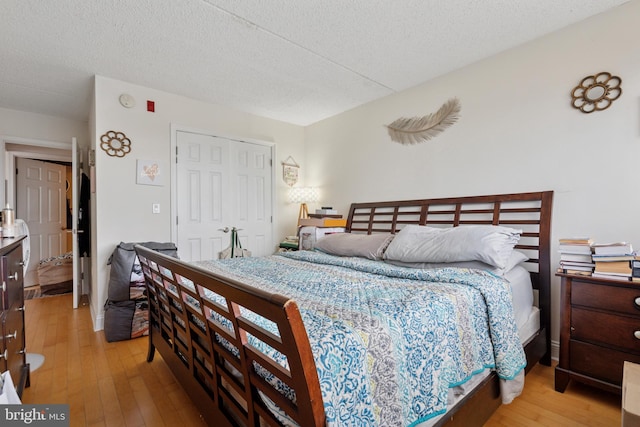 200 Lombard St Unit 728, Philadelphia, PA 19147 - bedroom with light wood finished floors, a closet, and a textured ceiling