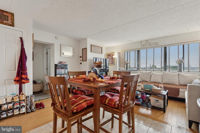 200 Lombard St Unit 728, Philadelphia, PA 19147 - dining area with a textured ceiling and light wood finished floors