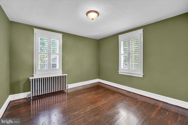 802 E Prospect Ave, North Wales, PA 19454 - unfurnished room featuring radiator heating unit, healthy amount of natural light, baseboards, and hardwood / wood-style flooring