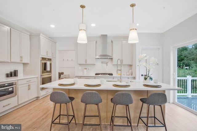 134 Kinsey Dr, Prince Frederick, MD 20678 - kitchen with wall chimney exhaust hood, stainless steel double oven, a sink, light countertops, and recessed lighting