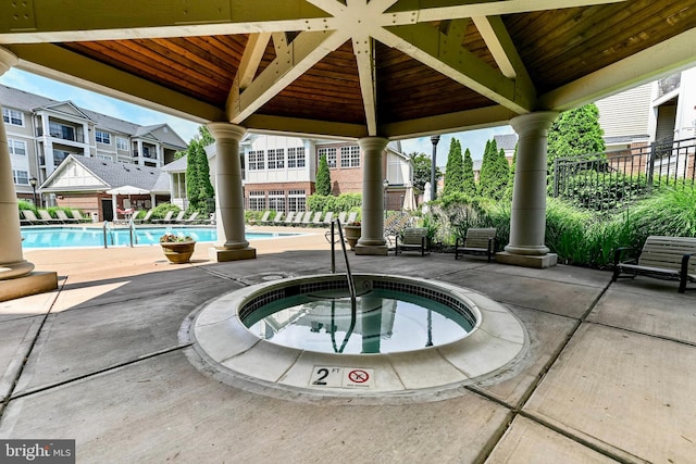 12909 Centre Park Cir Unit 306, Herndon, VA 20171 - community pool with a hot tub, a gazebo, and a patio area