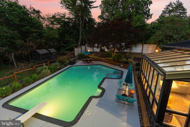 4304 Starview Ct, Glen Arm, MD 21057 - pool at dusk featuring an outdoor pool, a fenced backyard, and a patio area