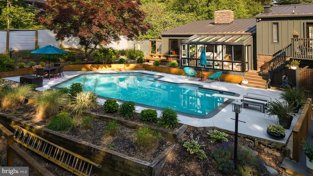 4304 Starview Ct, Glen Arm, MD 21057 - outdoor pool featuring a sunroom, stairs, a diving board, outdoor dining space, and a patio