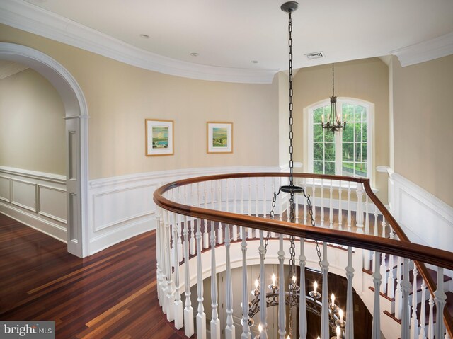 1412 Mount Pleasant Rd, Villanova, PA 19085 - hallway with wood finished floors, crown molding, a wainscoted wall, a chandelier, and a decorative wall