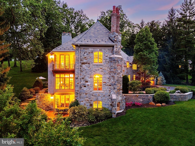 1412 Mount Pleasant Rd, Villanova, PA 19085 - back of house featuring a high end roof, a chimney, a balcony, and a yard