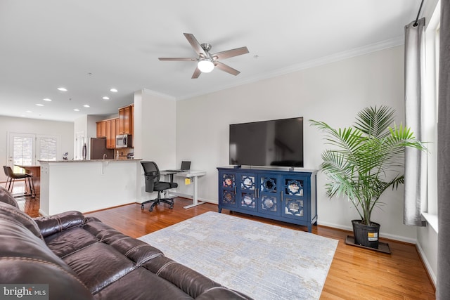 9161 Landon House Ln, Frederick, MD 21704 - living area with ceiling fan, light wood finished floors, baseboards, recessed lighting, and ornamental molding
