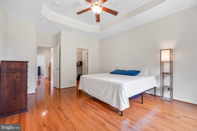 9161 Landon House Ln, Frederick, MD 21704 - bedroom featuring a tray ceiling, light wood-style flooring, ornamental molding, baseboards, and a ceiling fan