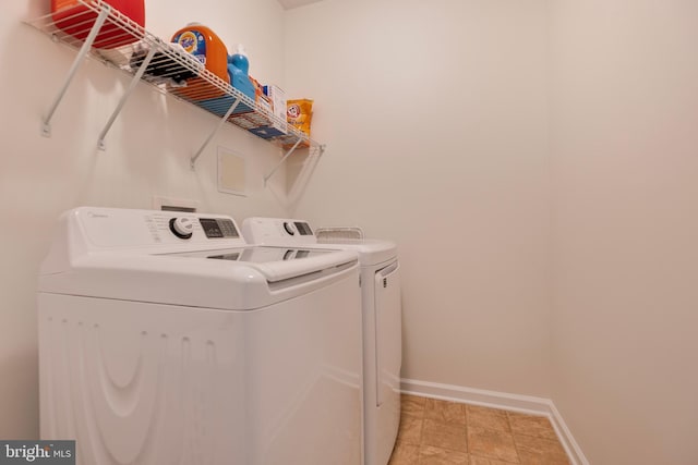 9161 Landon House Ln, Frederick, MD 21704 - laundry room with washing machine and clothes dryer and baseboards