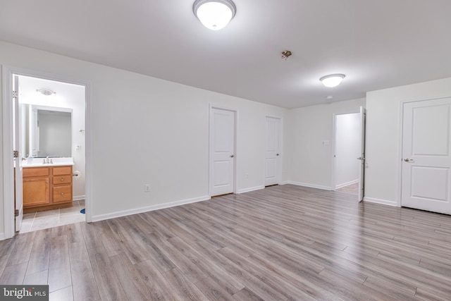 9161 Landon House Ln, Frederick, MD 21704 - unfurnished bedroom with light wood-style flooring, ensuite bath, and baseboards