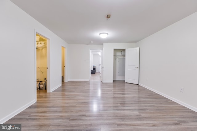 9161 Landon House Ln, Frederick, MD 21704 - unfurnished bedroom with a closet, light wood-type flooring, and baseboards