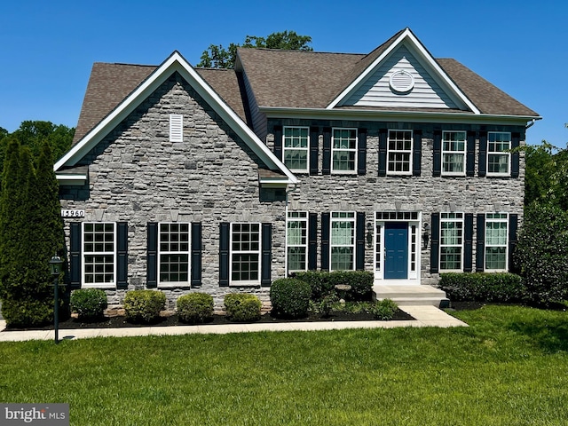 15960 Kruhm Rd, Burtonsville, MD 20866 - colonial house with stone siding, a front lawn, and a shingled roof
