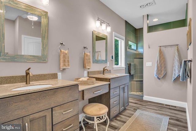61 Bragg Dr, East Berlin, PA 17316 - full bathroom featuring double vanity, a stall shower, and wood finished floors
