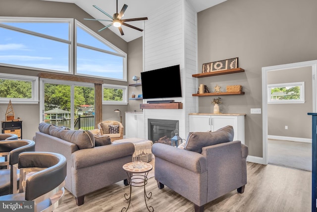 61 Bragg Dr, East Berlin, PA 17316 - living room featuring high vaulted ceiling, ceiling fan, light wood-style flooring, and a fireplace