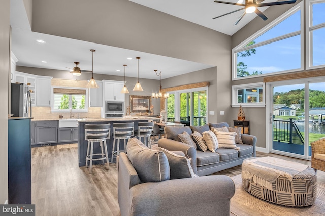 61 Bragg Dr, East Berlin, PA 17316 - living area with a ceiling fan, light wood-style floors, recessed lighting, a chandelier, and a high ceiling