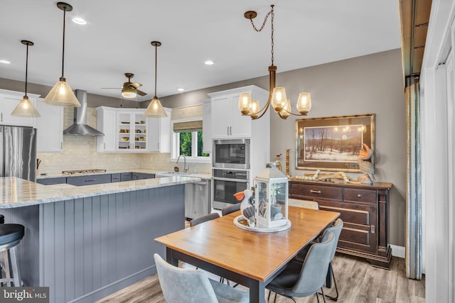 61 Bragg Dr, East Berlin, PA 17316 - dining room with light wood finished floors, a ceiling fan, a chandelier, and recessed lighting