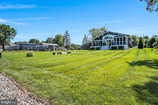 61 Bragg Dr, East Berlin, PA 17316 - view of grassy yard with a sunroom