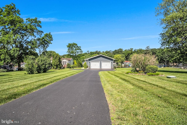 61 Bragg Dr, East Berlin, PA 17316 - view of front facade with a front lawn and a detached garage