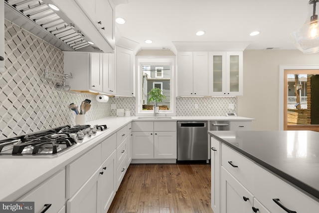 1217 Carrollsburg Pl SW, Washington, DC 20024 - kitchen with appliances with stainless steel finishes, premium range hood, a sink, white cabinets, and recessed lighting