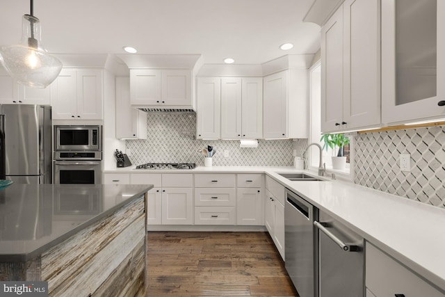 1217 Carrollsburg Pl SW, Washington, DC 20024 - kitchen featuring stainless steel appliances, a sink, white cabinets, and recessed lighting