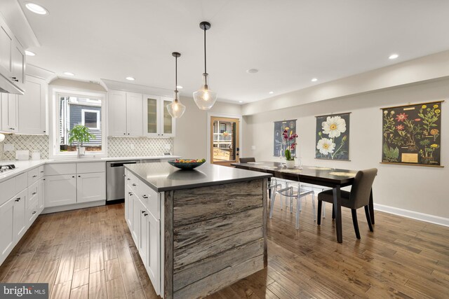 1217 Carrollsburg Pl SW, Washington, DC 20024 - kitchen featuring dishwasher, recessed lighting, backsplash, white cabinets, and a center island