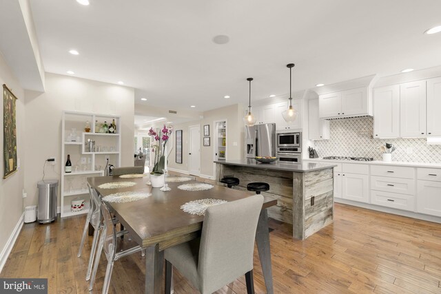 1217 Carrollsburg Pl SW, Washington, DC 20024 - dining space with recessed lighting, light wood-style floors, and baseboards