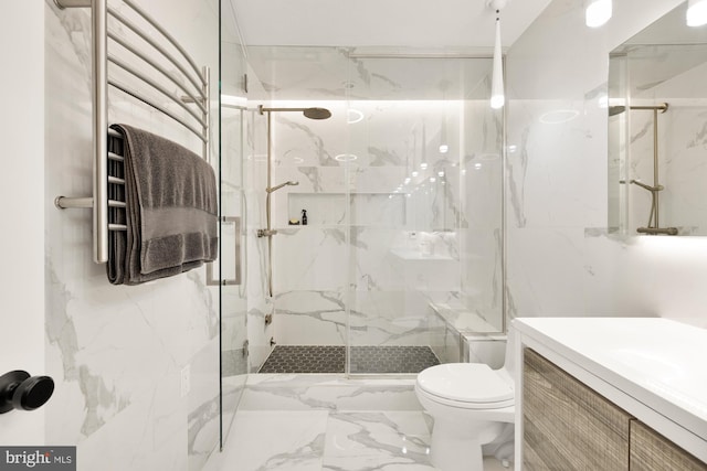 1217 Carrollsburg Pl SW, Washington, DC 20024 - full bath featuring toilet, a towel warming rack, a marble finish shower, vanity, and marble finish floors