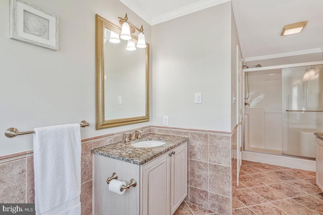 3300 Shore Dr, Annapolis, MD 21403 - full bathroom featuring tile walls, ornamental molding, a wainscoted wall, a shower stall, and vanity