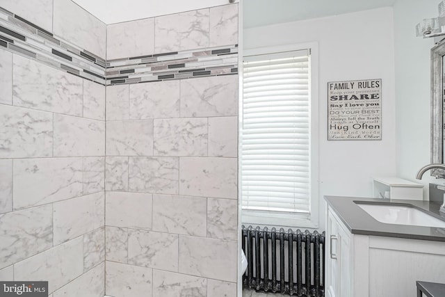 3725 King Ave, Pennsauken, NJ 08110 - bathroom featuring radiator heating unit, vanity, and plenty of natural light