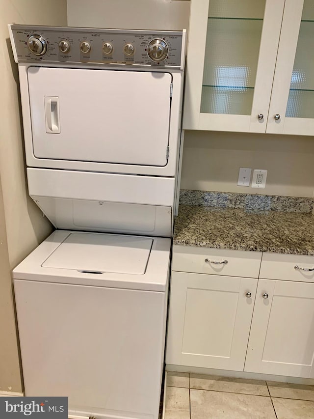 3528 14th St N, Arlington, VA 22201 - laundry area featuring estacked washer and dryer and light tile patterned floors