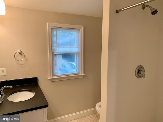 3528 14th St N, Arlington, VA 22201 - full bath featuring toilet, a shower, vanity, and baseboards