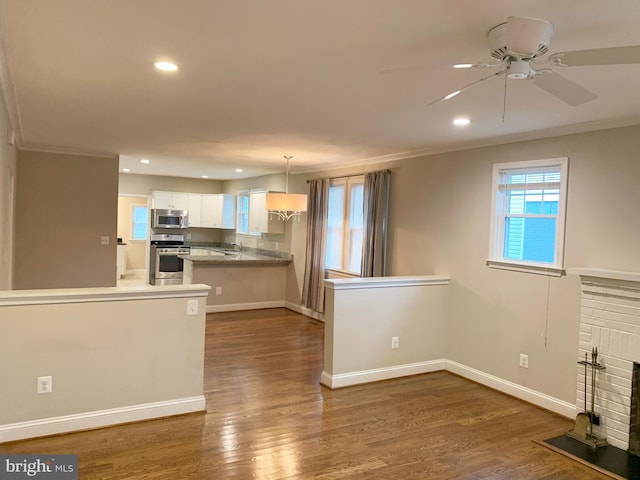 3528 14th St N, Arlington, VA 22201 - kitchen with stainless steel appliances, ornamental molding, recessed lighting, white cabinetry, and ceiling fan