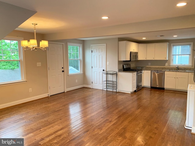 3528 14th St N, Arlington, VA 22201 - kitchen featuring appliances with stainless steel finishes, a chandelier, a sink, dark wood-type flooring, and recessed lighting