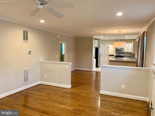 3528 14th St N, Arlington, VA 22201 - unfurnished living room featuring recessed lighting, ornamental molding, wood finished floors, baseboards, and a ceiling fan