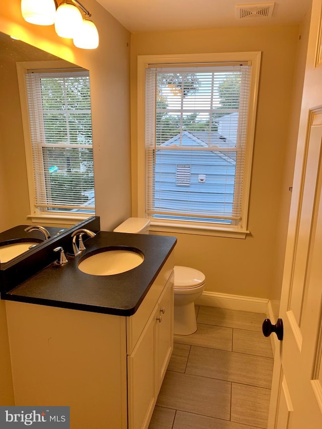 3528 14th St N, Arlington, VA 22201 - bathroom with toilet, vanity, baseboards, and tile patterned flooring