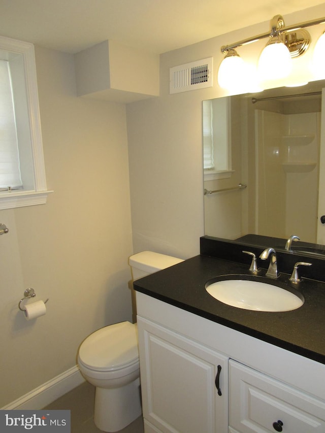 3528 14th St N, Arlington, VA 22201 - bathroom with vanity, toilet, and baseboards