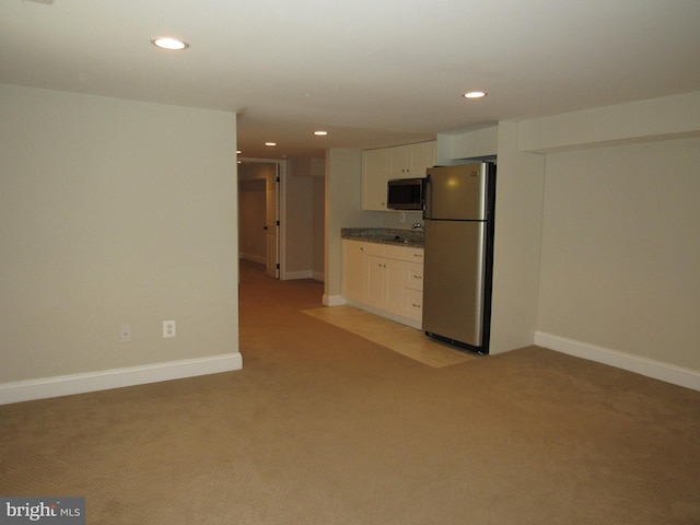 3528 14th St N, Arlington, VA 22201 - kitchen featuring appliances with stainless steel finishes, light colored carpet, white cabinets, recessed lighting, and baseboards