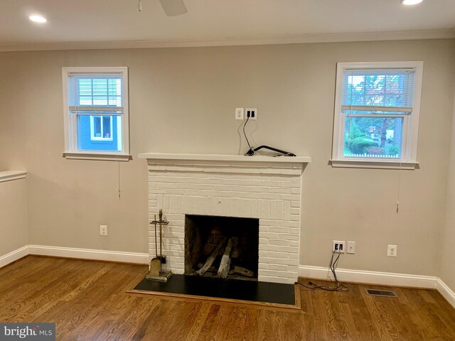 3528 14th St N, Arlington, VA 22201 - detailed view of ornamental molding, baseboards, wood finished floors, recessed lighting, and a brick fireplace