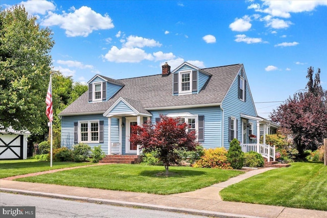 217 E Chestnut St, Cleona, PA 17042 - cape cod house with a chimney, roof with shingles, and a front lawn