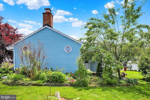 217 E Chestnut St, Cleona, PA 17042 - view of side of property with a lawn and a chimney