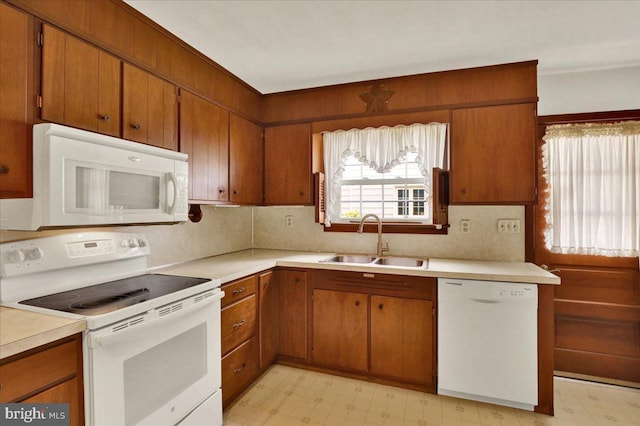 217 E Chestnut St, Cleona, PA 17042 - kitchen featuring white appliances, light flooring, a sink, light countertops, and brown cabinets